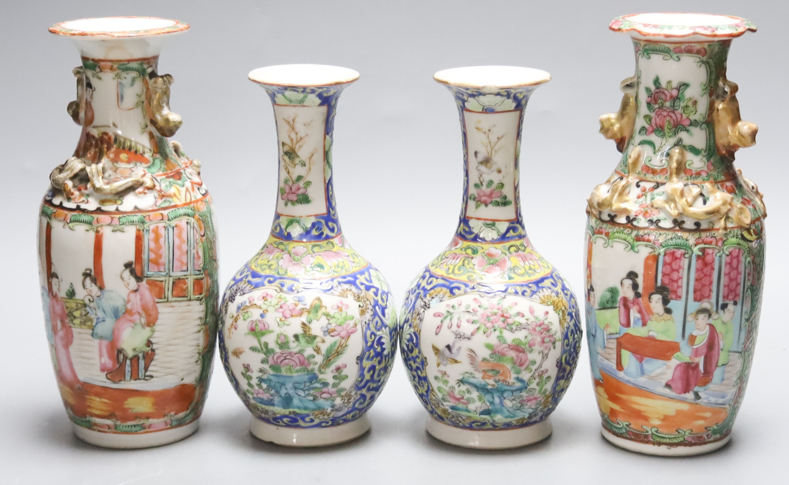 Four 19th century Chinese famille rose vases, 21cm